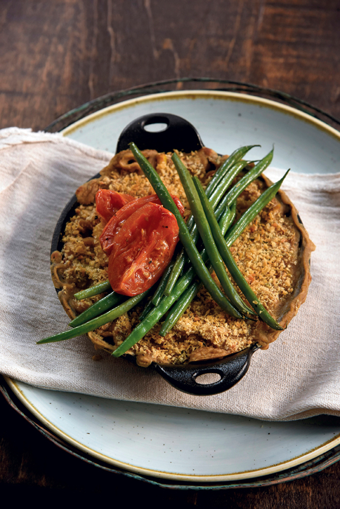Vegan cassoulet of simmered white beans, oven-roasted tomatoes, leeks, haricot verts with an herb crust