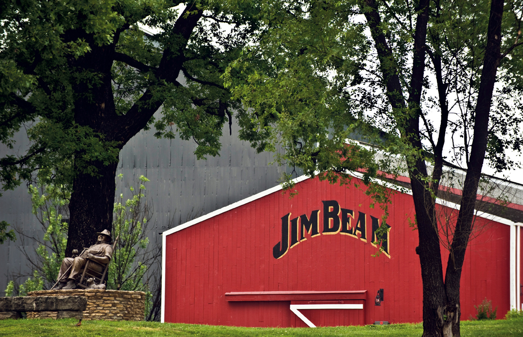 A statue of Booker Now (and his dog, Dot) keeps watch at the Jim Beam American Stillhouse in Clermont, Kentucky.