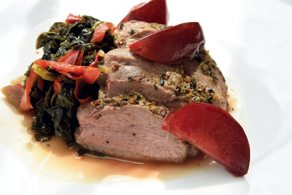 Duck breast with collard greens and roasted peaches