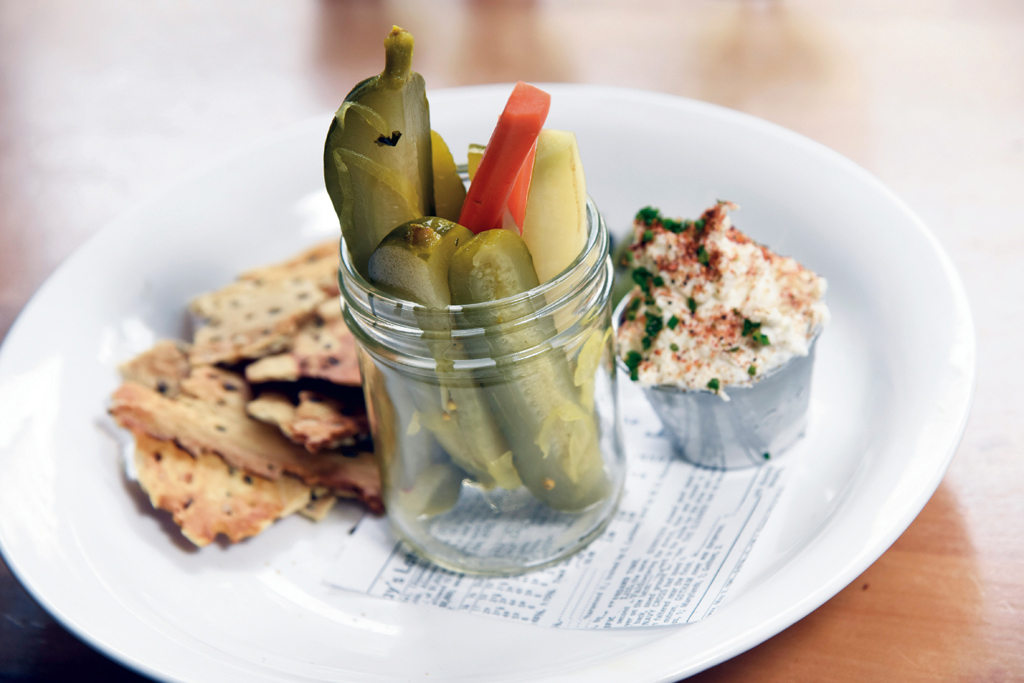 Bourbon Barrel pickles with smoked onion dip and flax seed cracker